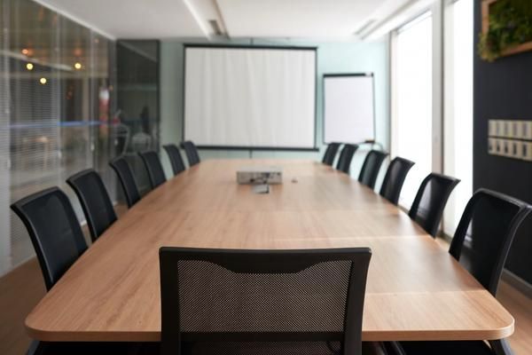 Illustration for the article “Conference Table in HSR Layout | Professional Meeting Spaces”