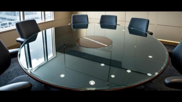Illustration for the article “Glass Discussion Table in Old Airport â A Modern Touch to Office Interiors”